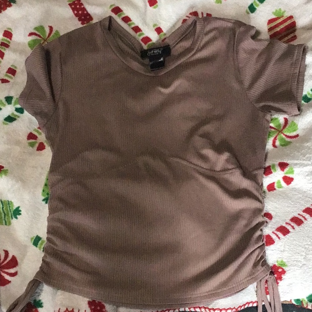 brown short sleeve, rises up on stomach a bit. never worn
